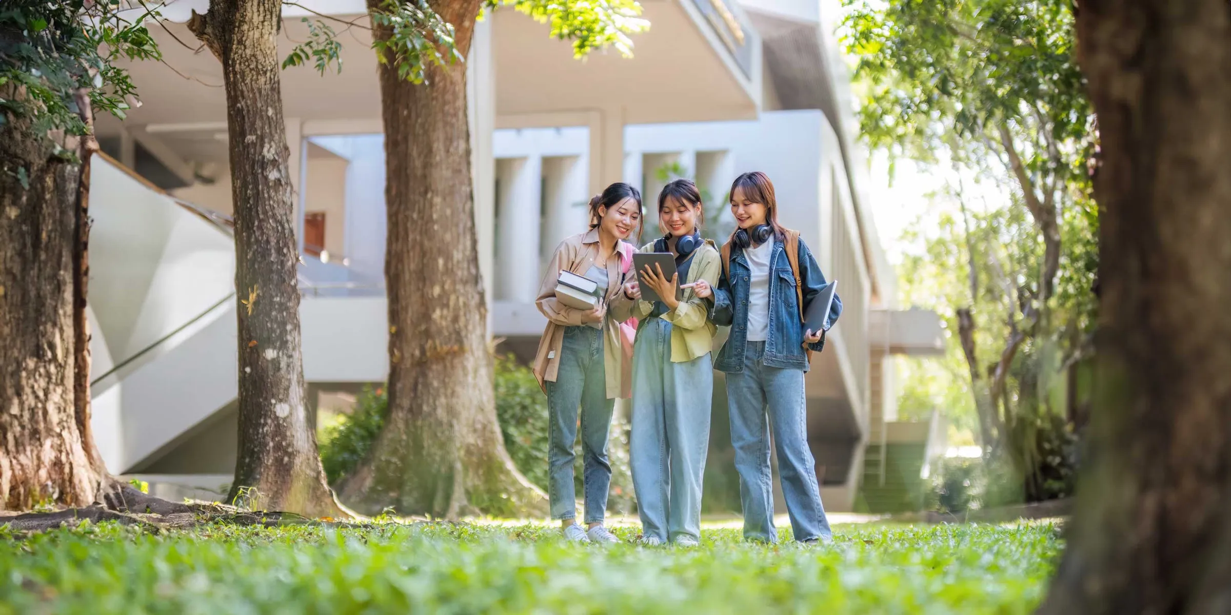 Two students chatting and smiling together after class